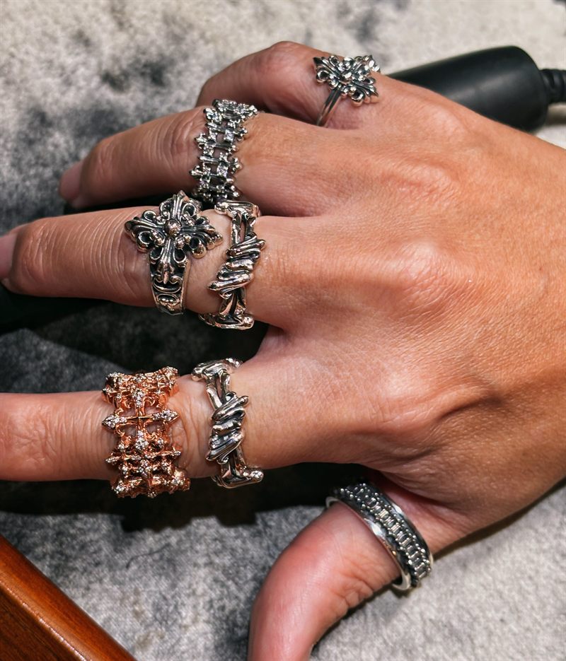 AKE AKE rings styled together on a hand